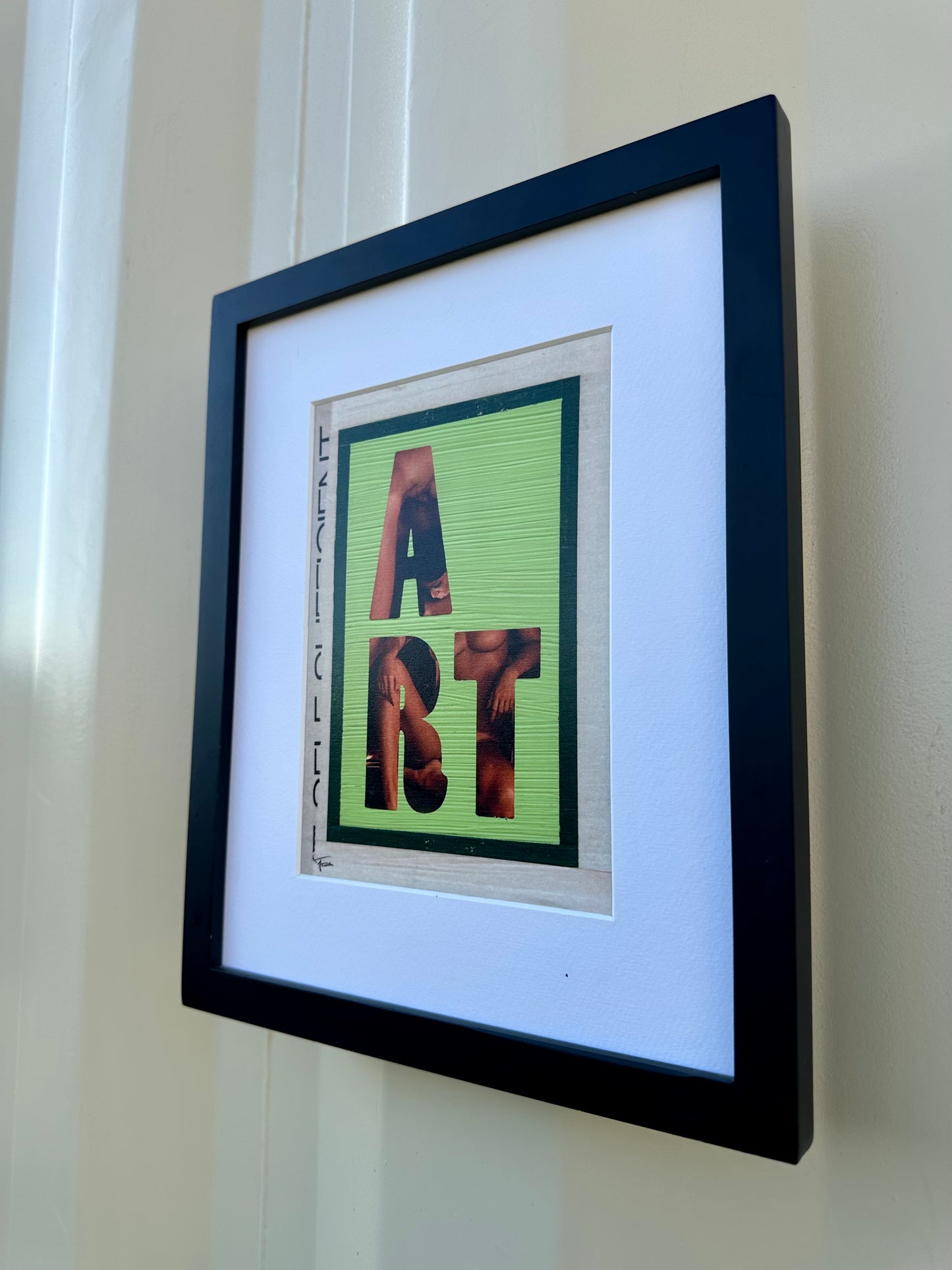 Framed print of original mixed media art featuring the word ART over image from vintage magazine